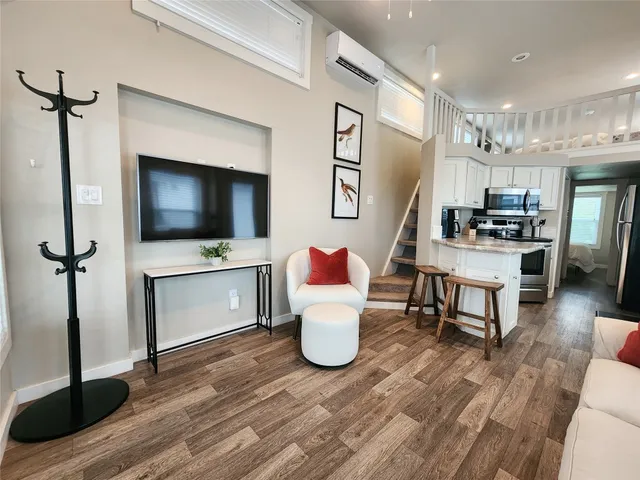 a living room with furniture and a window