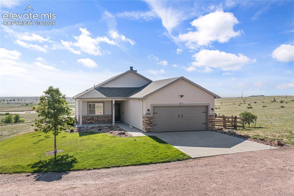 2105 Slocum Road Peyton, CO 80831 - Photo 1 of 31 a view of a house with a yard
