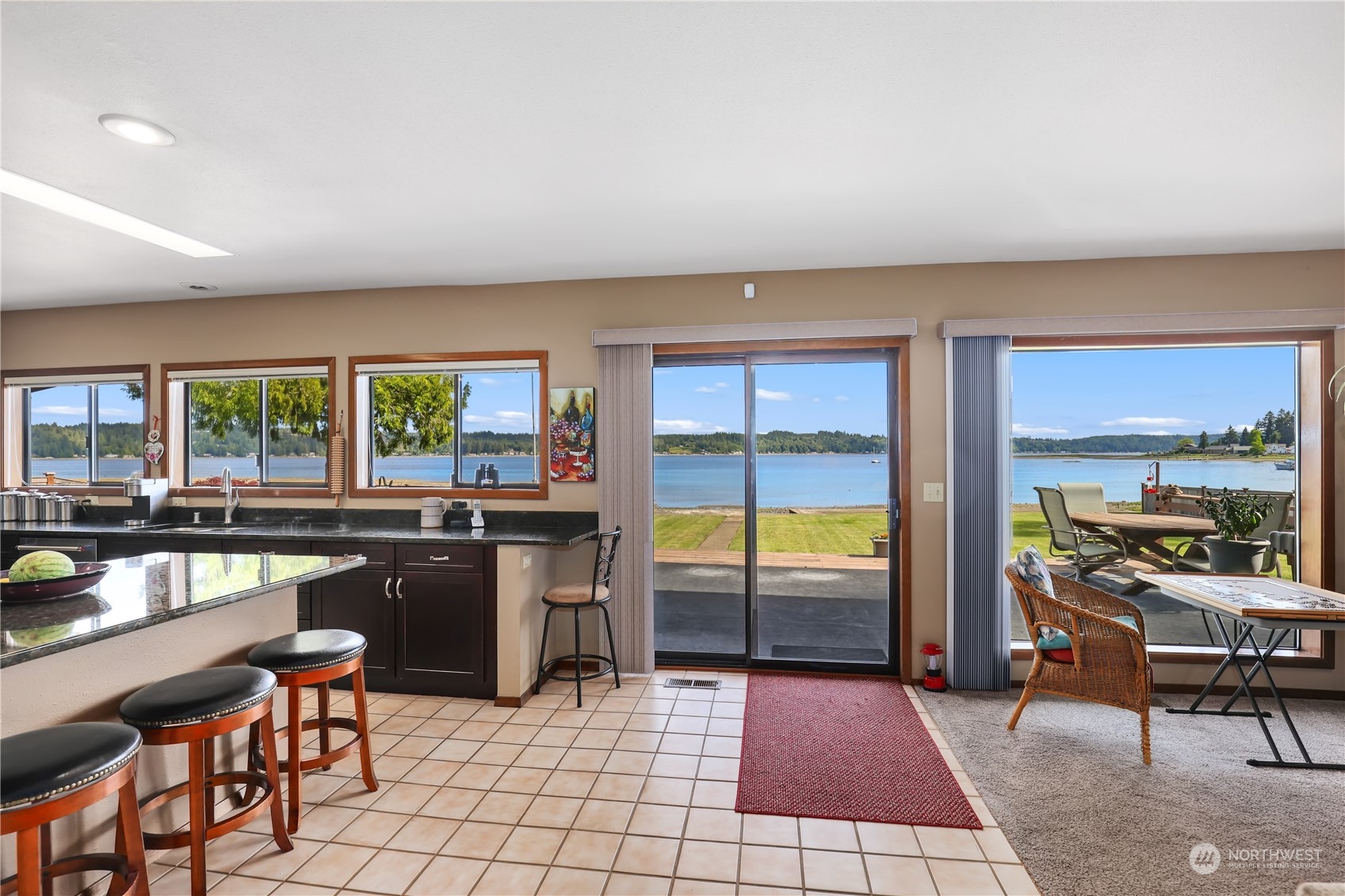 101 Northeast Sundstrom Road Belfair, WA 98528 - Photo 14 of 40 a open kitchen with a table and chairs in front of it