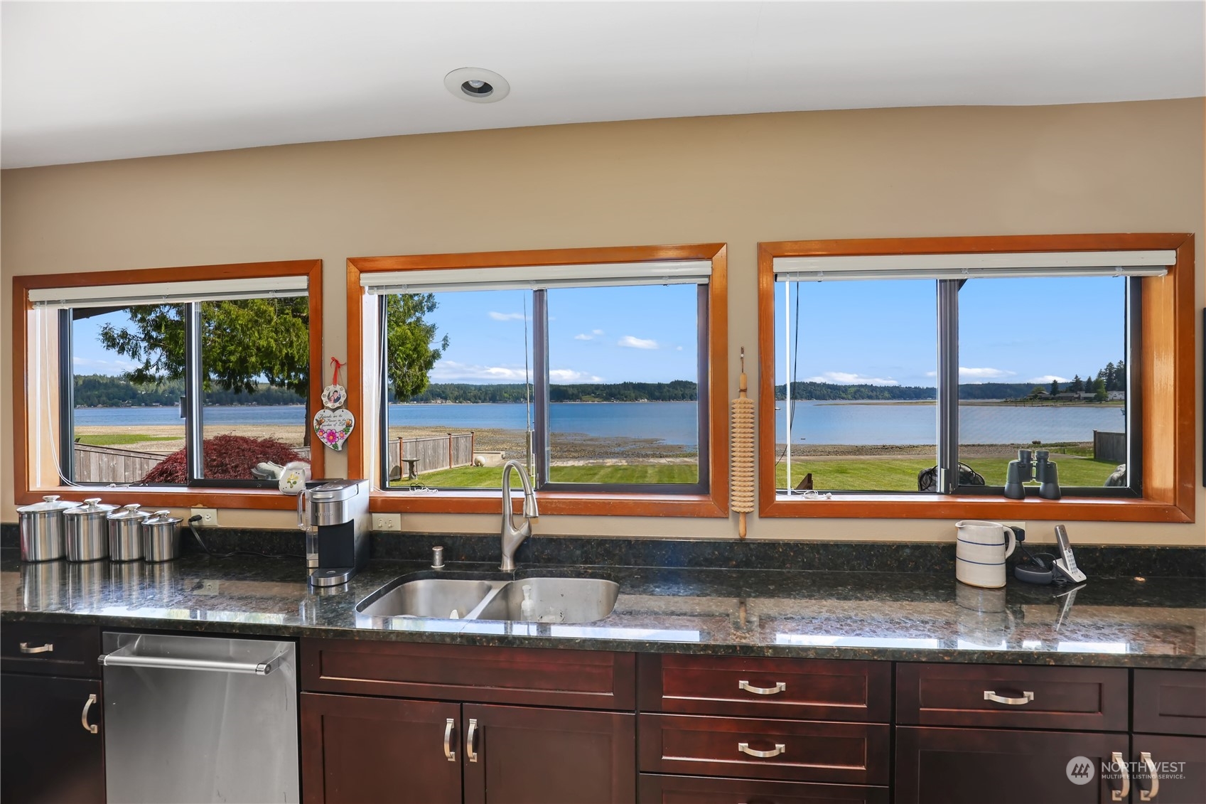 101 Northeast Sundstrom Road Belfair, WA 98528 - Photo 16 of 40 a kitchen with granite countertop a sink and a window