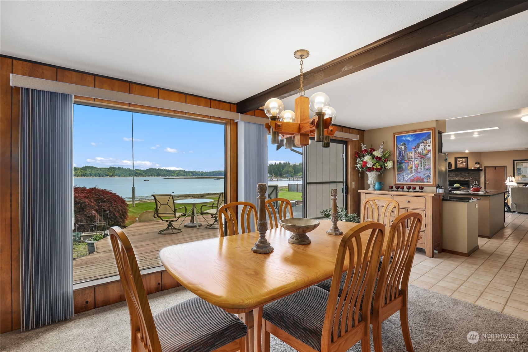 101 Northeast Sundstrom Road Belfair, WA 98528 - Photo 19 of 40 a dining room with furniture and a floor to ceiling window