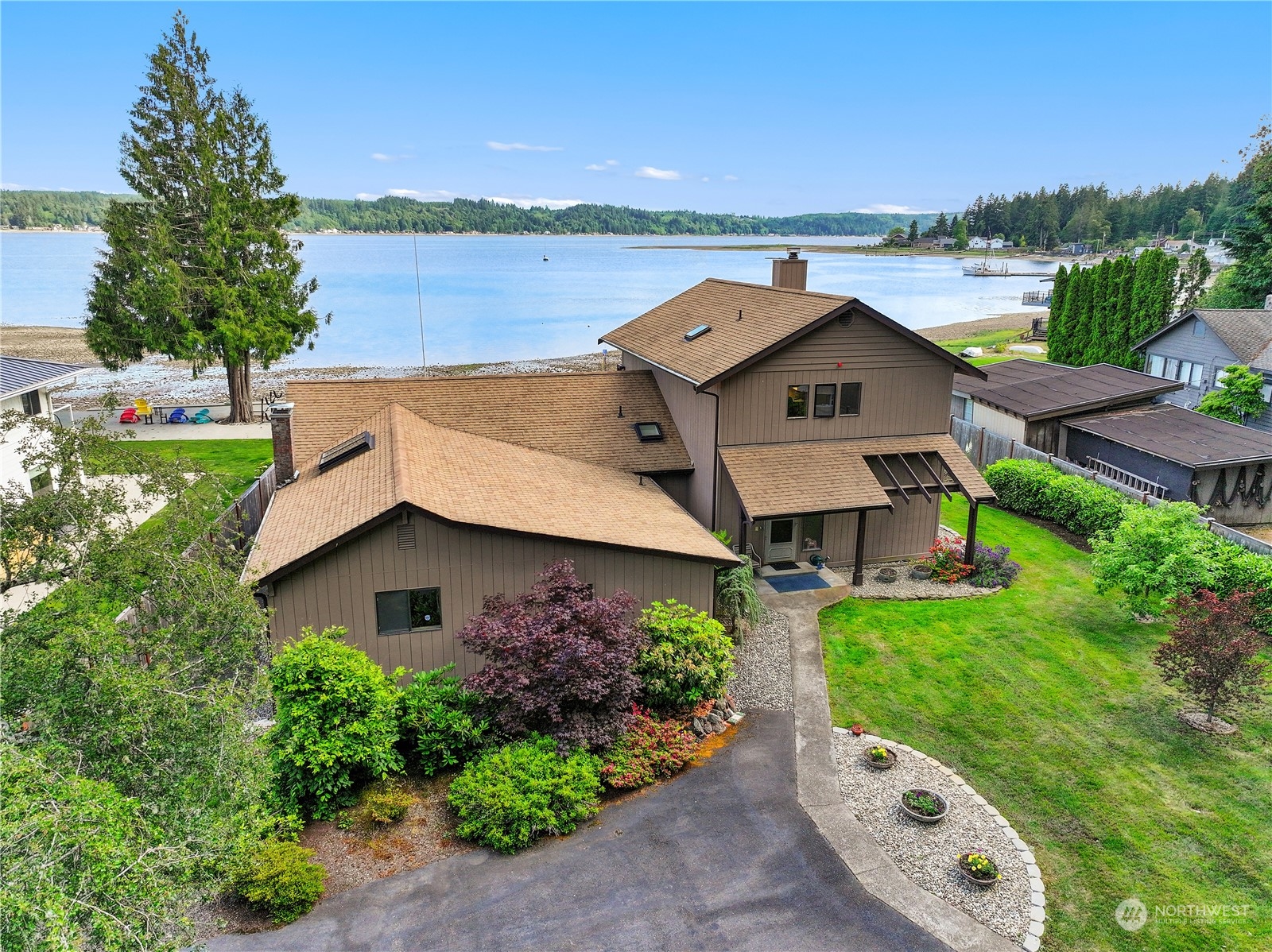 101 Northeast Sundstrom Road Belfair, WA 98528 - Photo 2 of 40 an aerial view of a house with a yard and lake view