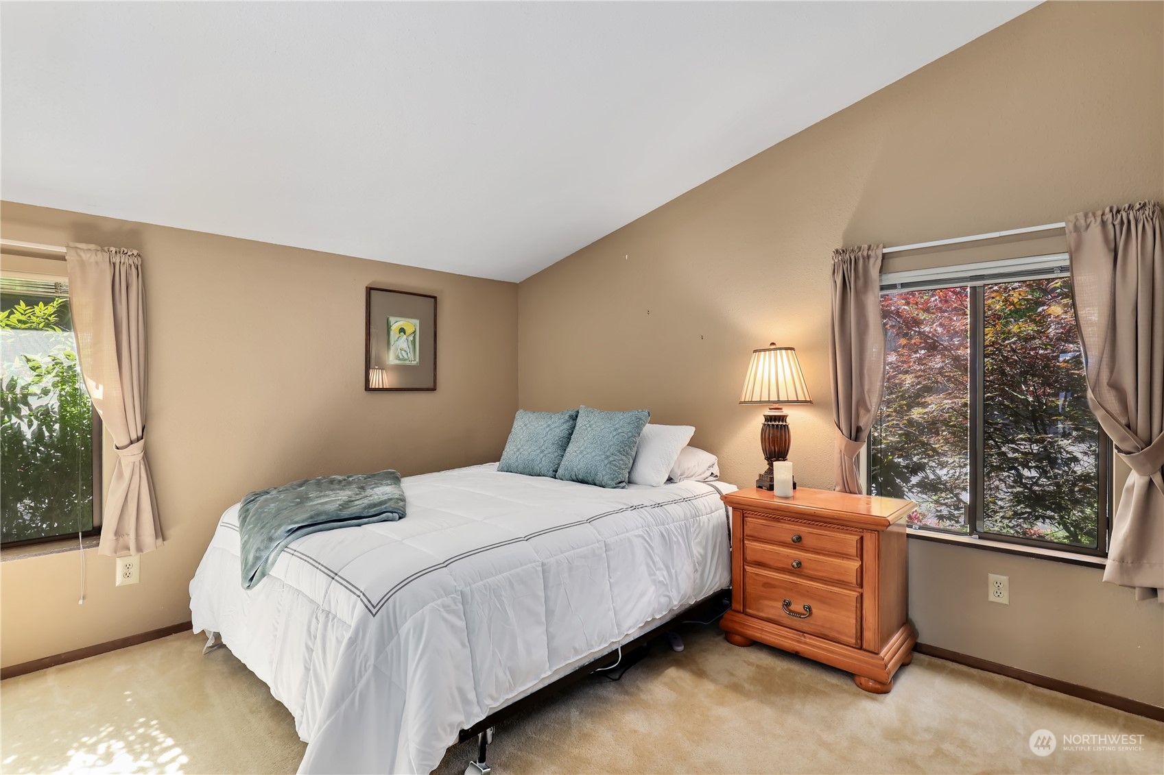 101 Northeast Sundstrom Road Belfair, WA 98528 - Photo 22 of 40 a bedroom with a bed and large window