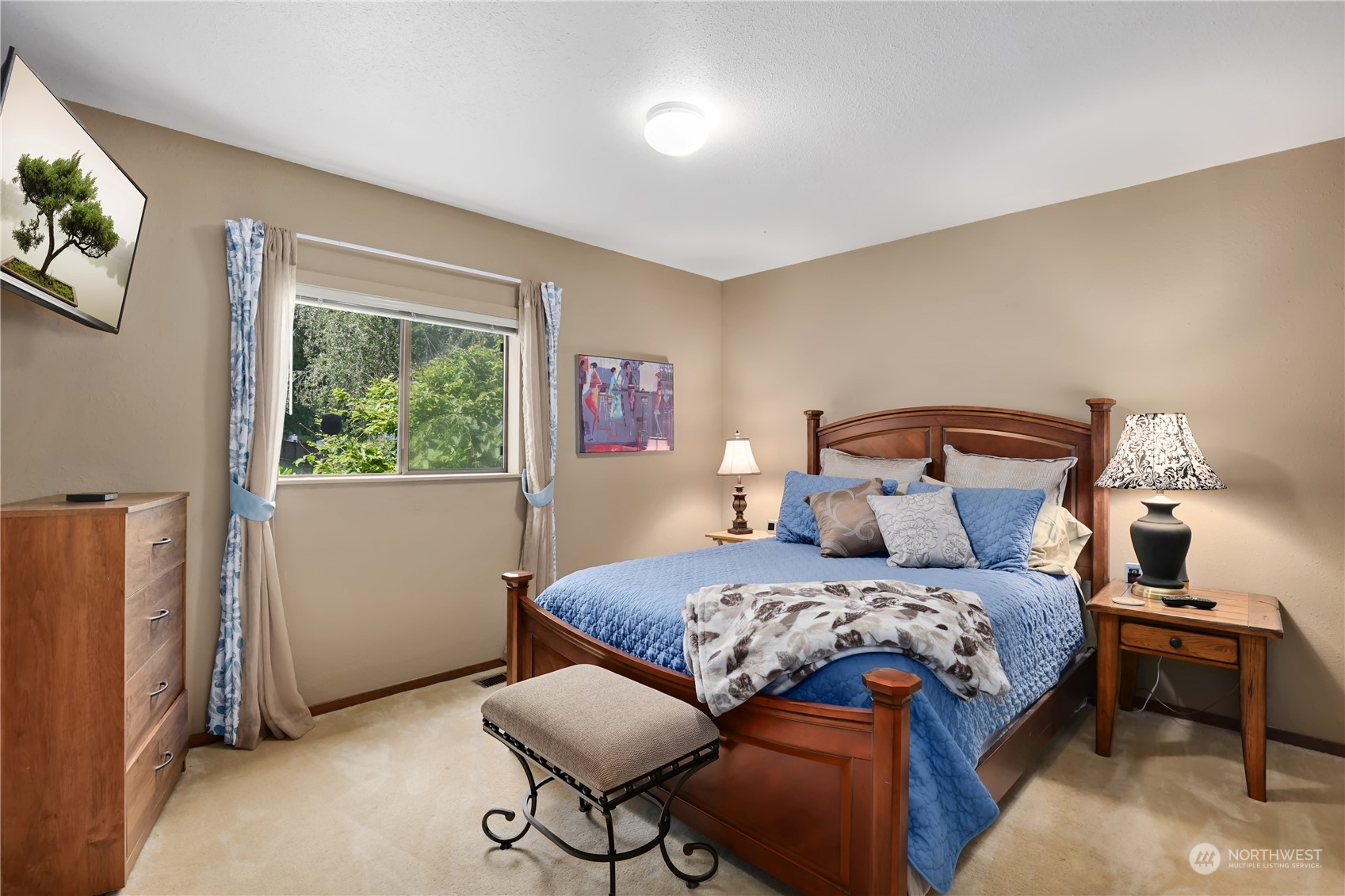 101 Northeast Sundstrom Road Belfair, WA 98528 - Photo 23 of 40 a bedroom with a bed and a window