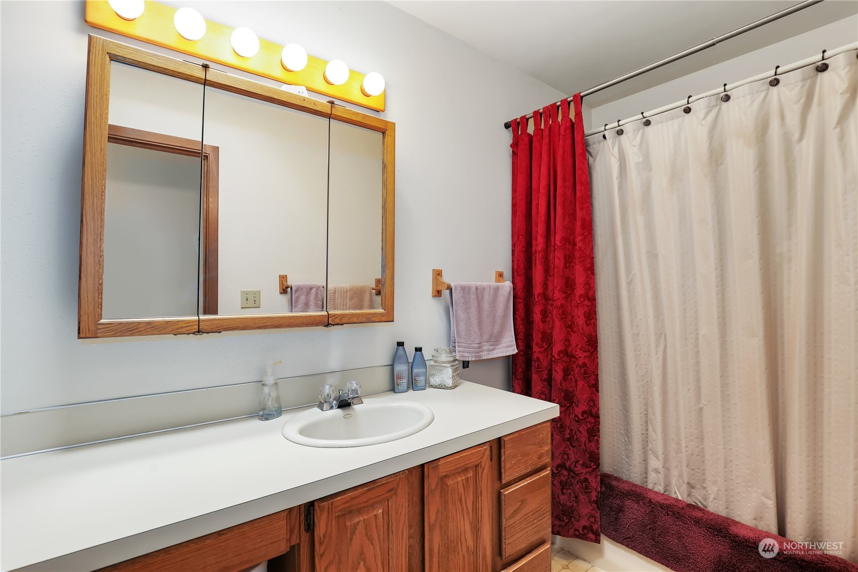 101 Northeast Sundstrom Road Belfair, WA 98528 - Photo 28 of 40 a bathroom with a sink and a mirror