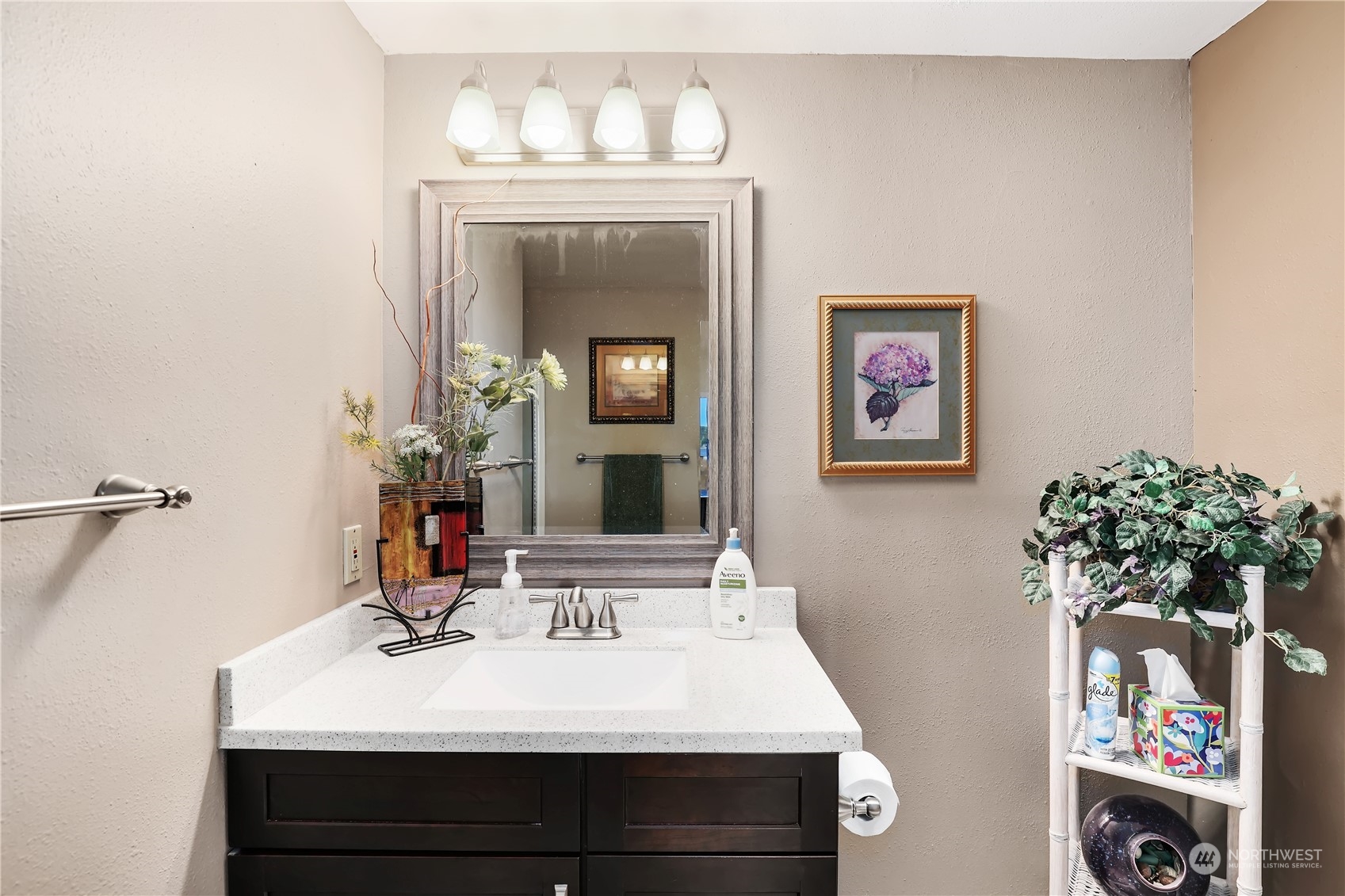 101 Northeast Sundstrom Road Belfair, WA 98528 - Photo 29 of 40 a bathroom with a sink vanity and a mirror