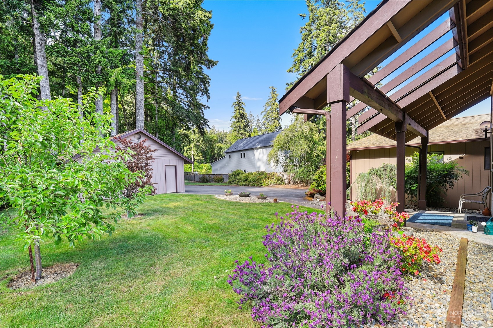 101 Northeast Sundstrom Road Belfair, WA 98528 - Photo 32 of 40 a view of a house with a backyard and garden