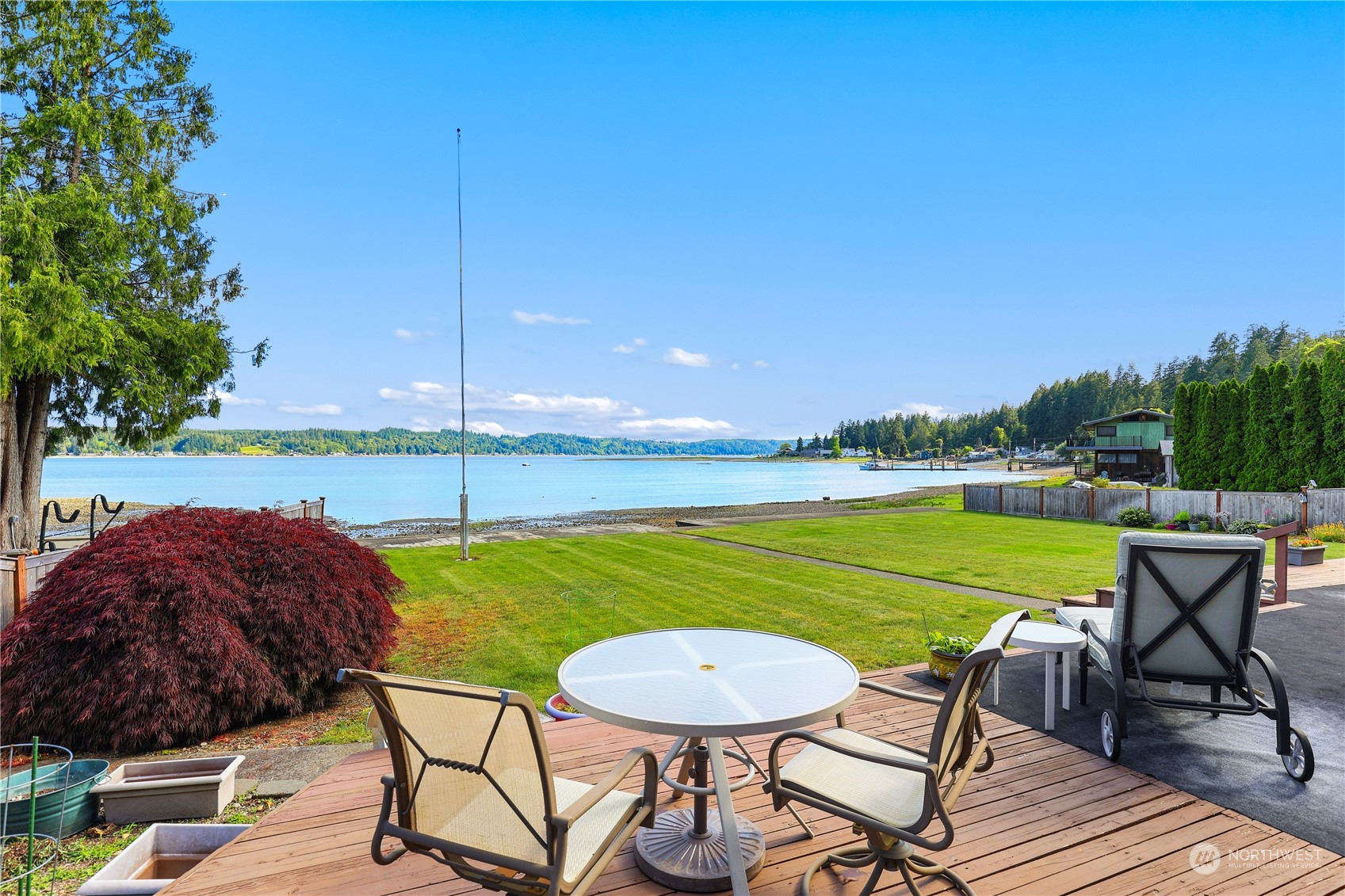 101 Northeast Sundstrom Road Belfair, WA 98528 - Photo 33 of 40 a view of a swimming pool and outdoor seating