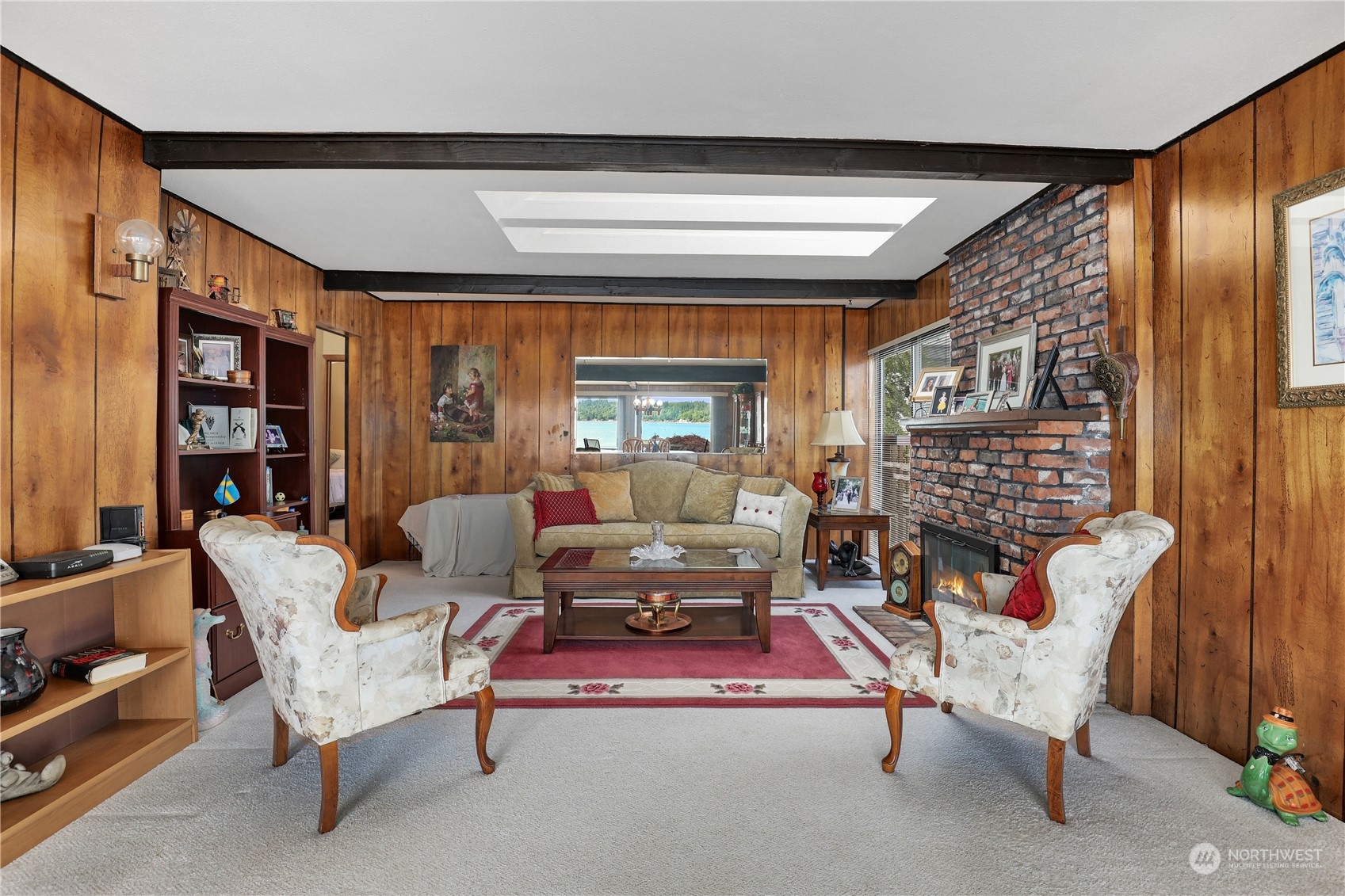 101 Northeast Sundstrom Road Belfair, WA 98528 - Photo 6 of 40 a living room with furniture fireplace and a large window