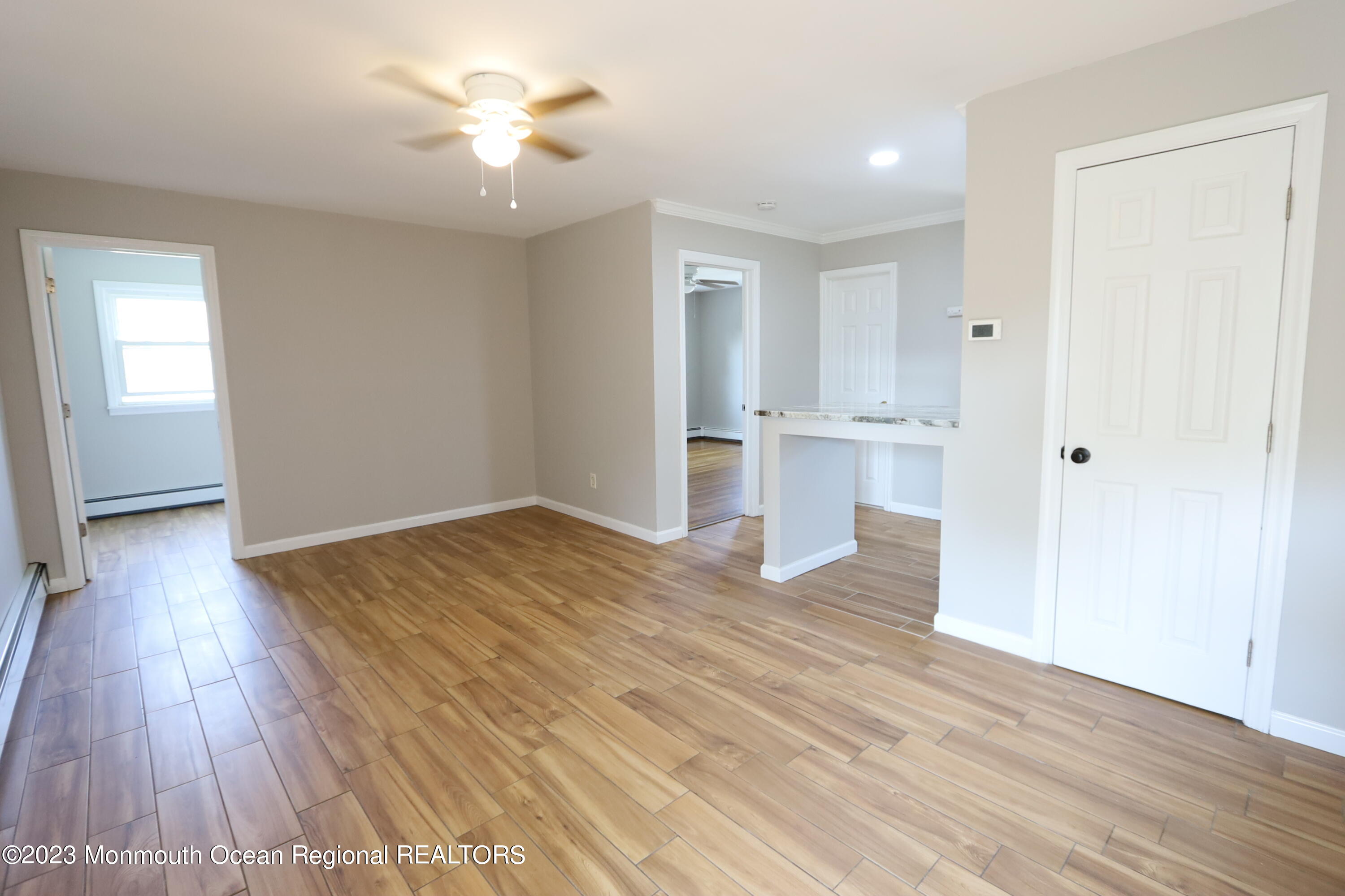 110 Union Avenue, Unit C Lakehurst, NJ 08733 - Photo 2 of 7 a view of empty room with wooden floor and fan