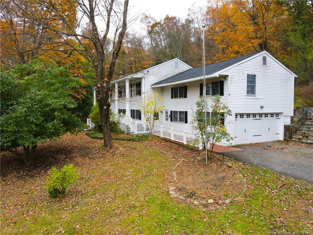 230 Lake Road Warren, CT 06777 - Photo 1 of 1 a view of a yard in front of a house with large trees