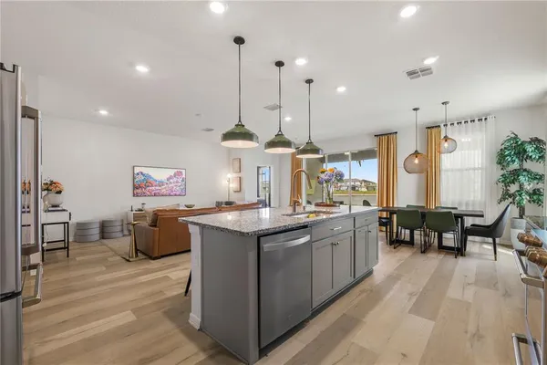 a kitchen with a sink stove and refrigerator