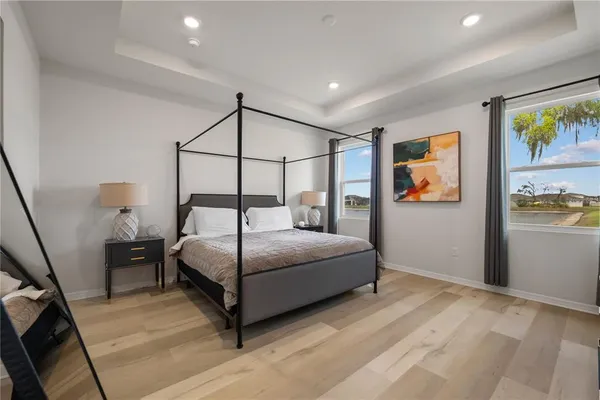 a bedroom with a bed and a dresser