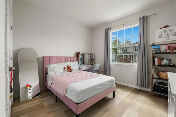 a bedroom with a bed and cabinets
