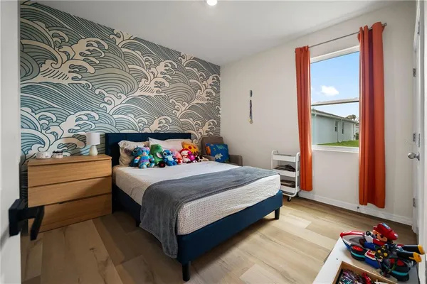 a bedroom with a bed and a closet