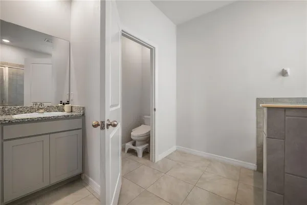 a bathroom with a sink and mirror