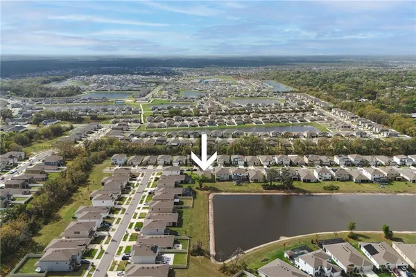 an aerial view of a house with a swimming pool