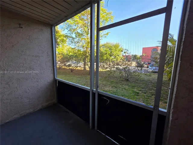 a view of a building with a garden