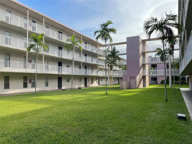 a view of building with yard