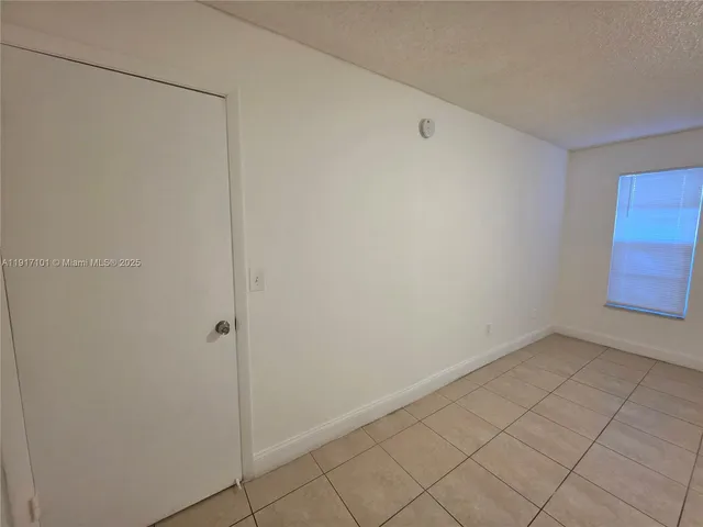 a bathroom with a mirror and a sink