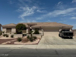 Ranch-style house with a garage and driveway