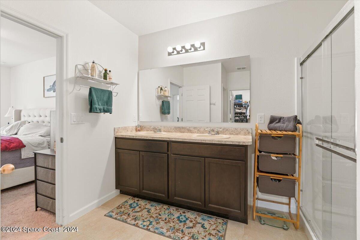 4332 Starling Place Mims, FL 32754 - Photo 15 of 28 a bathroom with a sink and a mirror