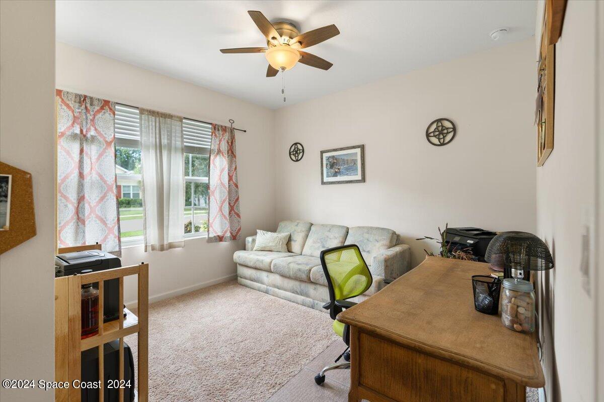 4332 Starling Place Mims, FL 32754 - Photo 16 of 28 a living room with furniture and a window