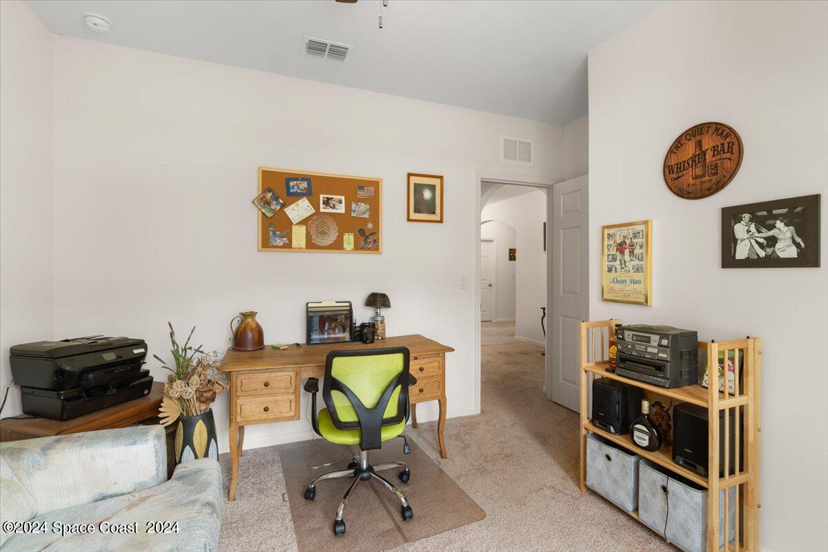 4332 Starling Place Mims, FL 32754 - Photo 17 of 28 a view of a workspace with furniture