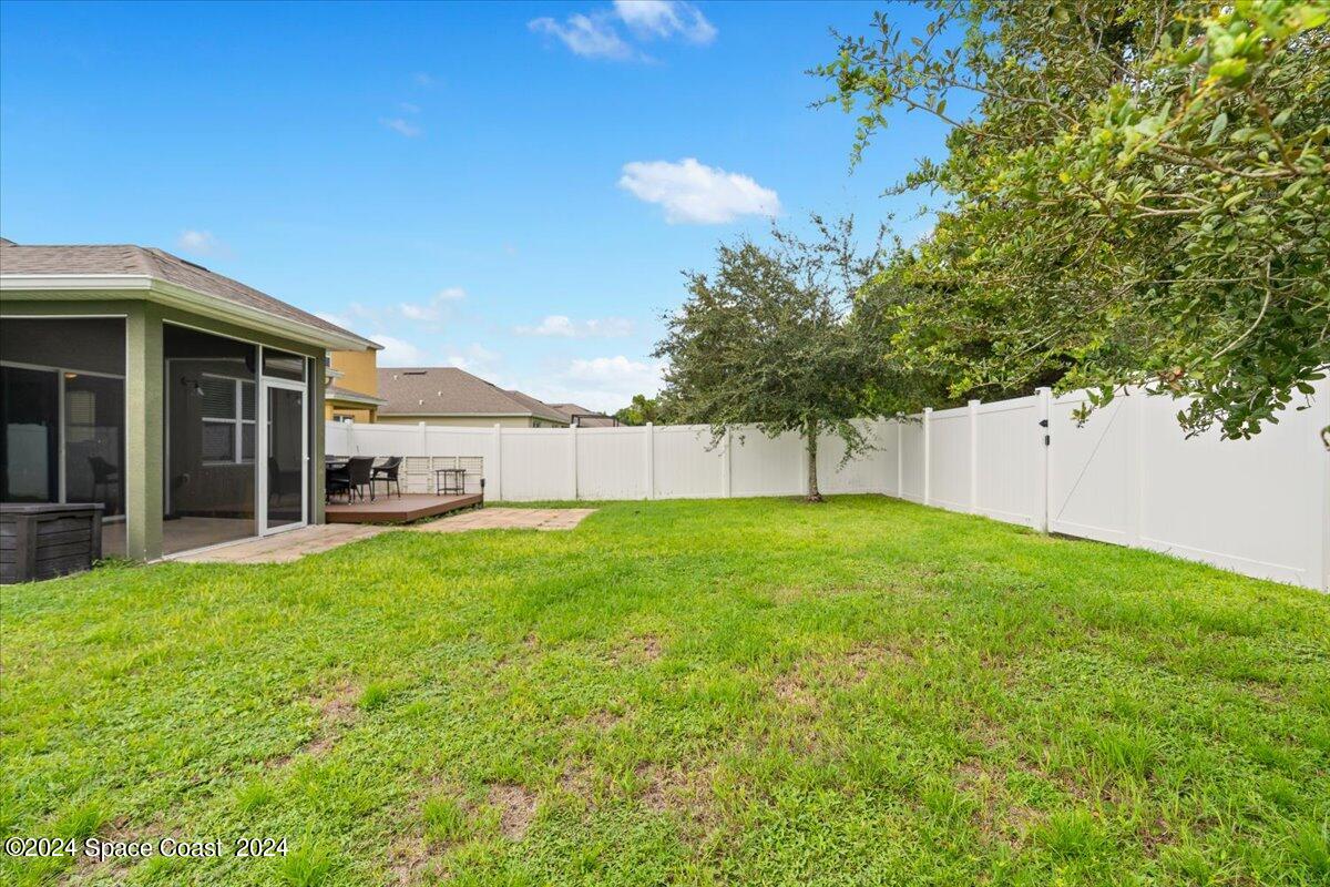 4332 Starling Place Mims, FL 32754 - Photo 24 of 28 a view of a back yard of the house