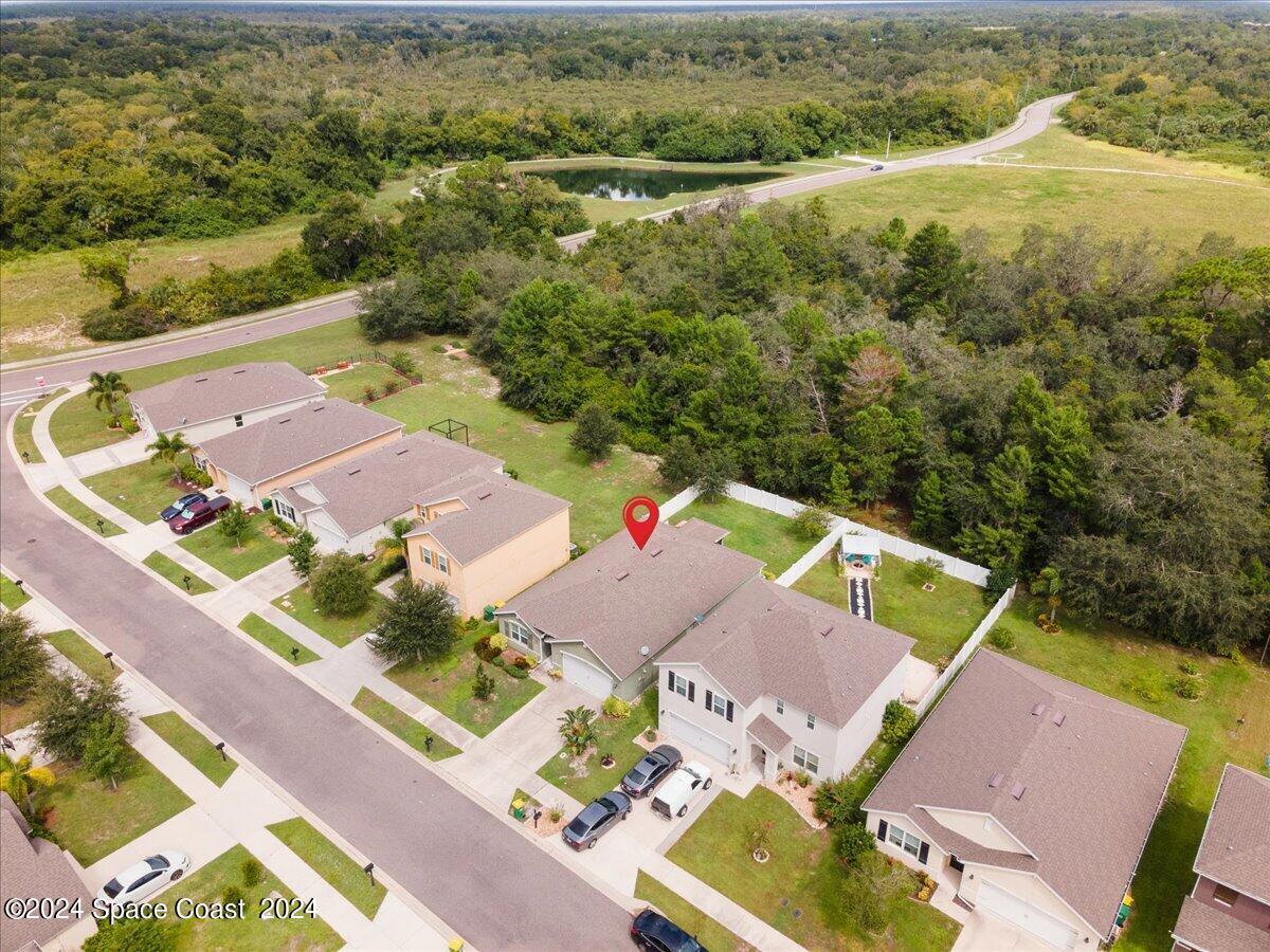 4332 Starling Place Mims, FL 32754 - Photo 25 of 28 an aerial view of residential houses with outdoor space