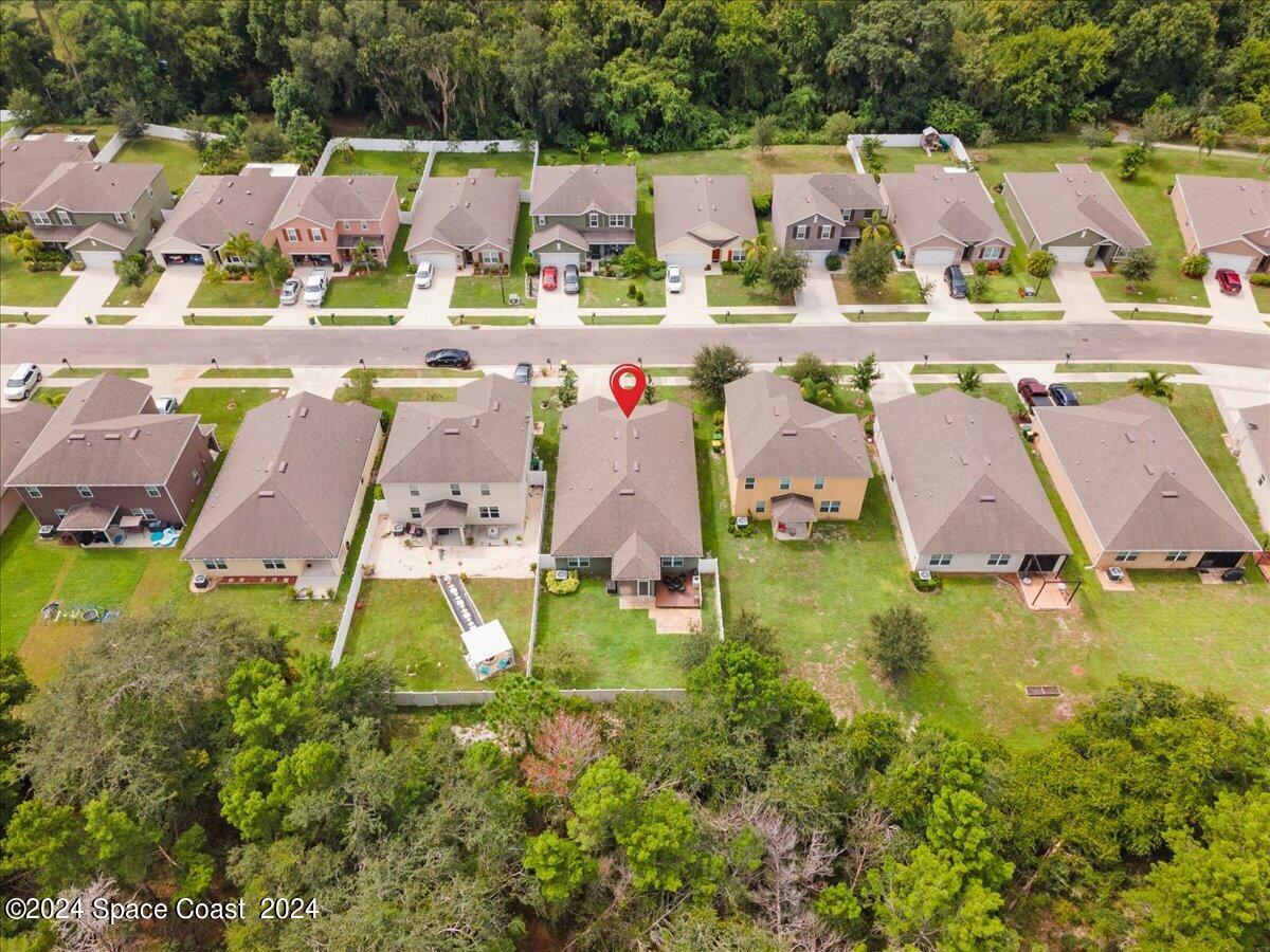 4332 Starling Place Mims, FL 32754 - Photo 26 of 28 an aerial view of residential houses with outdoor space and swimming pool