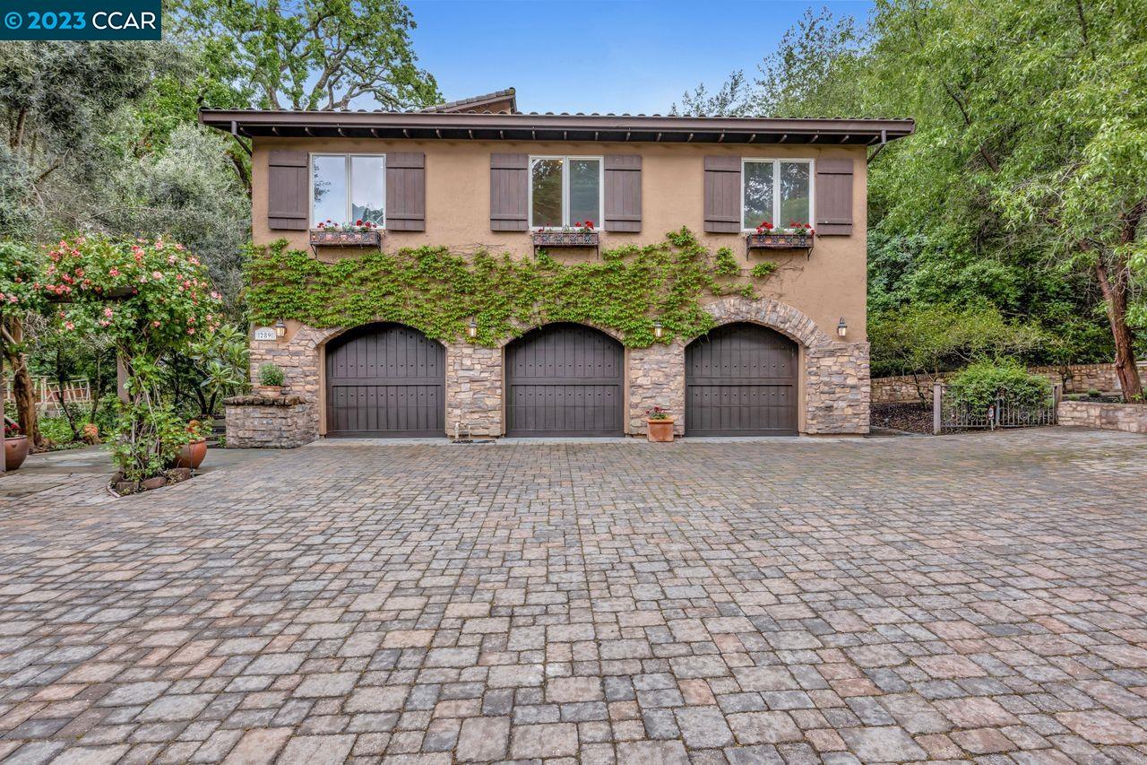 289 Castle Hill Ranch Road Walnut Creek, CA 94595 - Photo 1 of 1 a front view of a house with garden