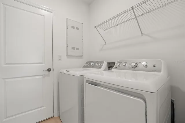 a utility room with dryer and washer
