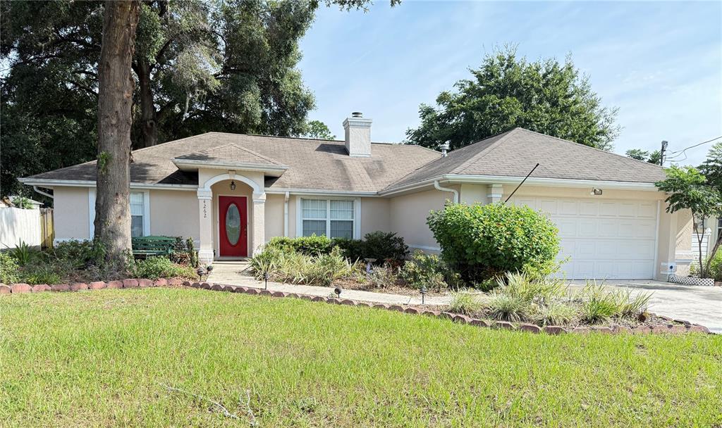 4262 Northeast 35th Avenue Road Ocala, FL 34479 - Photo 1 of 25 a front view of a house with a yard