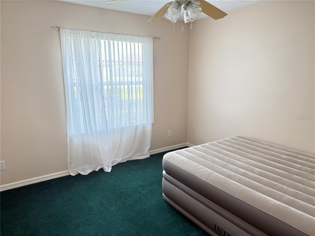 4262 Northeast 35th Avenue Road Ocala, FL 34479 - Photo 16 of 25 a bedroom with a bed and a window