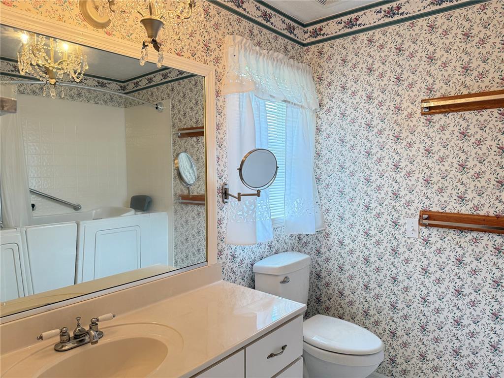4262 Northeast 35th Avenue Road Ocala, FL 34479 - Photo 19 of 25 a bathroom with a toilet sink and shower