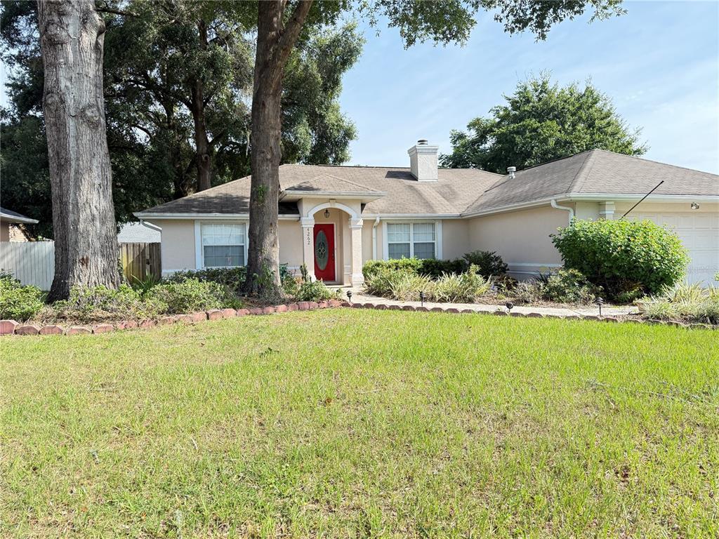4262 Northeast 35th Avenue Road Ocala, FL 34479 - Photo 2 of 25 front view of house with a yard