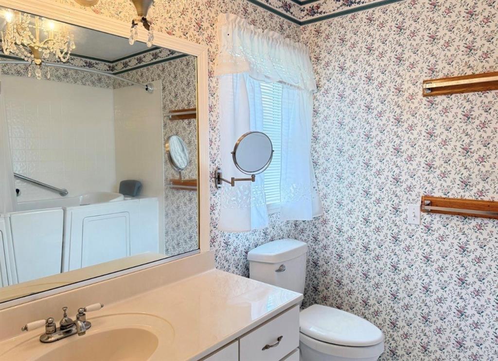 4262 Northeast 35th Avenue Road Ocala, FL 34479 - Photo 22 of 25 a bathroom with a sink a toilet and shower