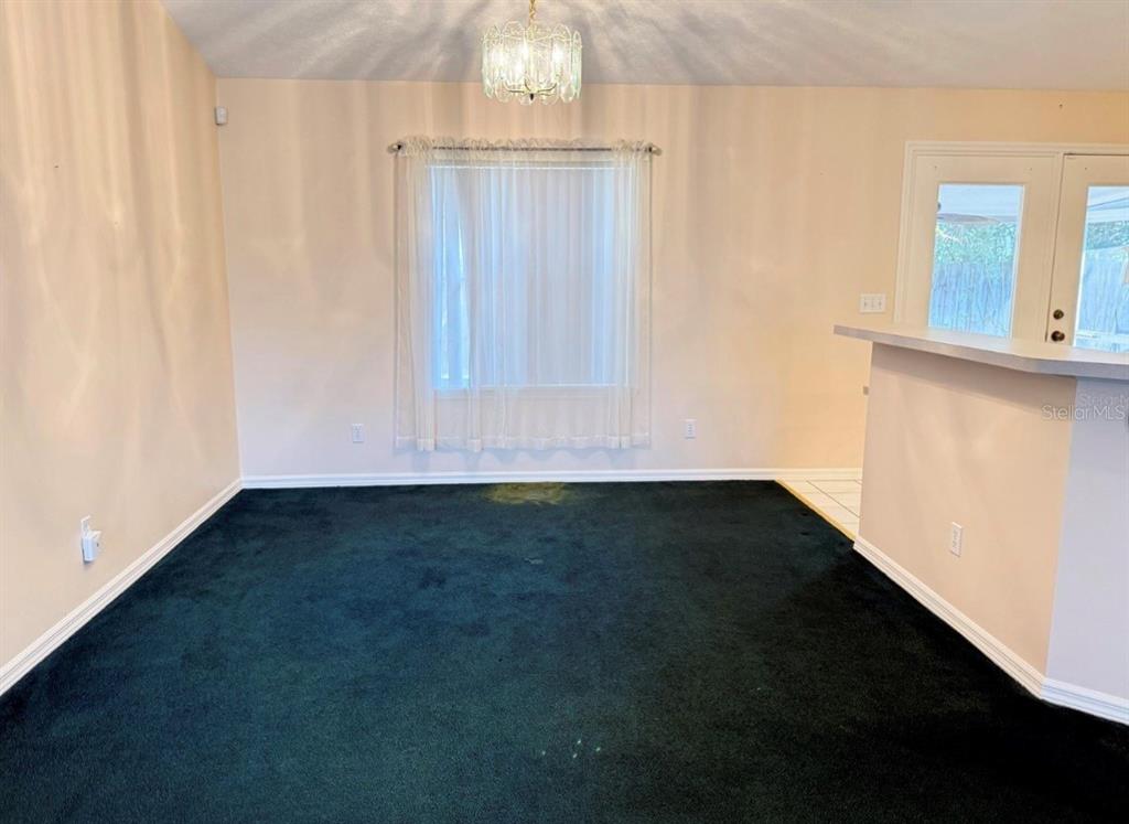 4262 Northeast 35th Avenue Road Ocala, FL 34479 - Photo 9 of 25 a view of an empty room with a window