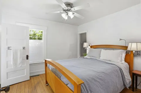 a bedroom with a bed and a chandelier