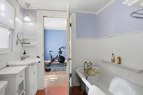 a kitchen with a sink cabinets and appliances