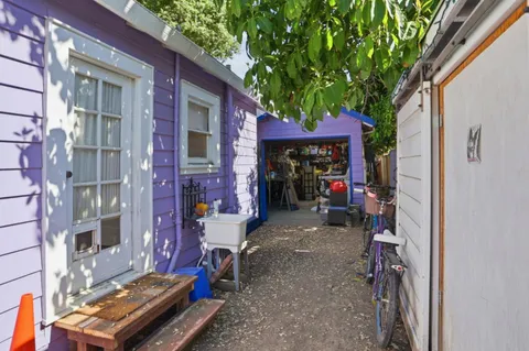 a view of a chairs with a small yard