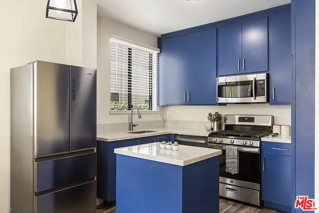 a kitchen with a refrigerator sink and microwave