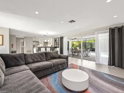 a living room with furniture and a table
