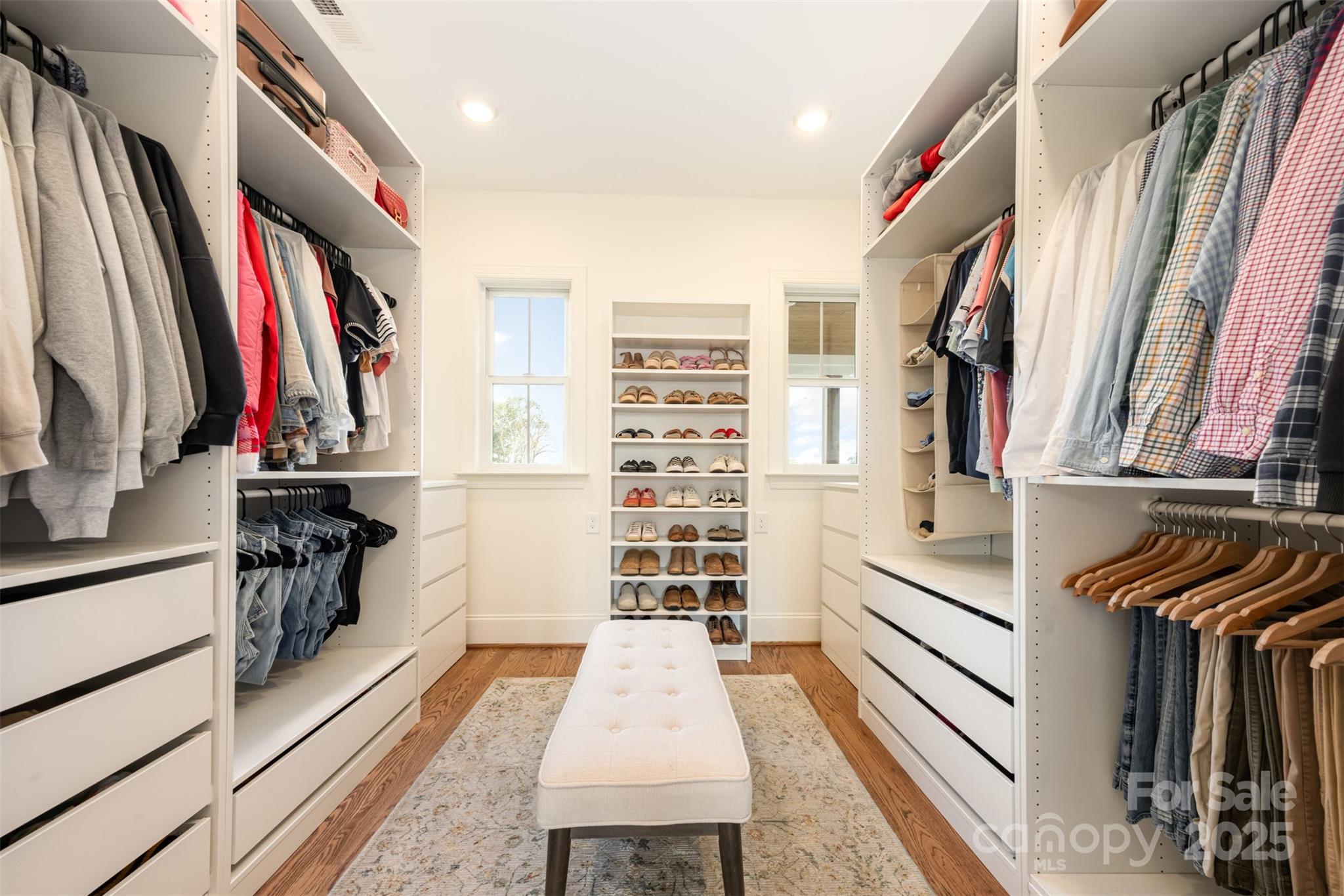 6322 Olive Branch Road Marshville, NC 28103 - Photo 11 of 28 a view of walk in closet with clothes and shoes