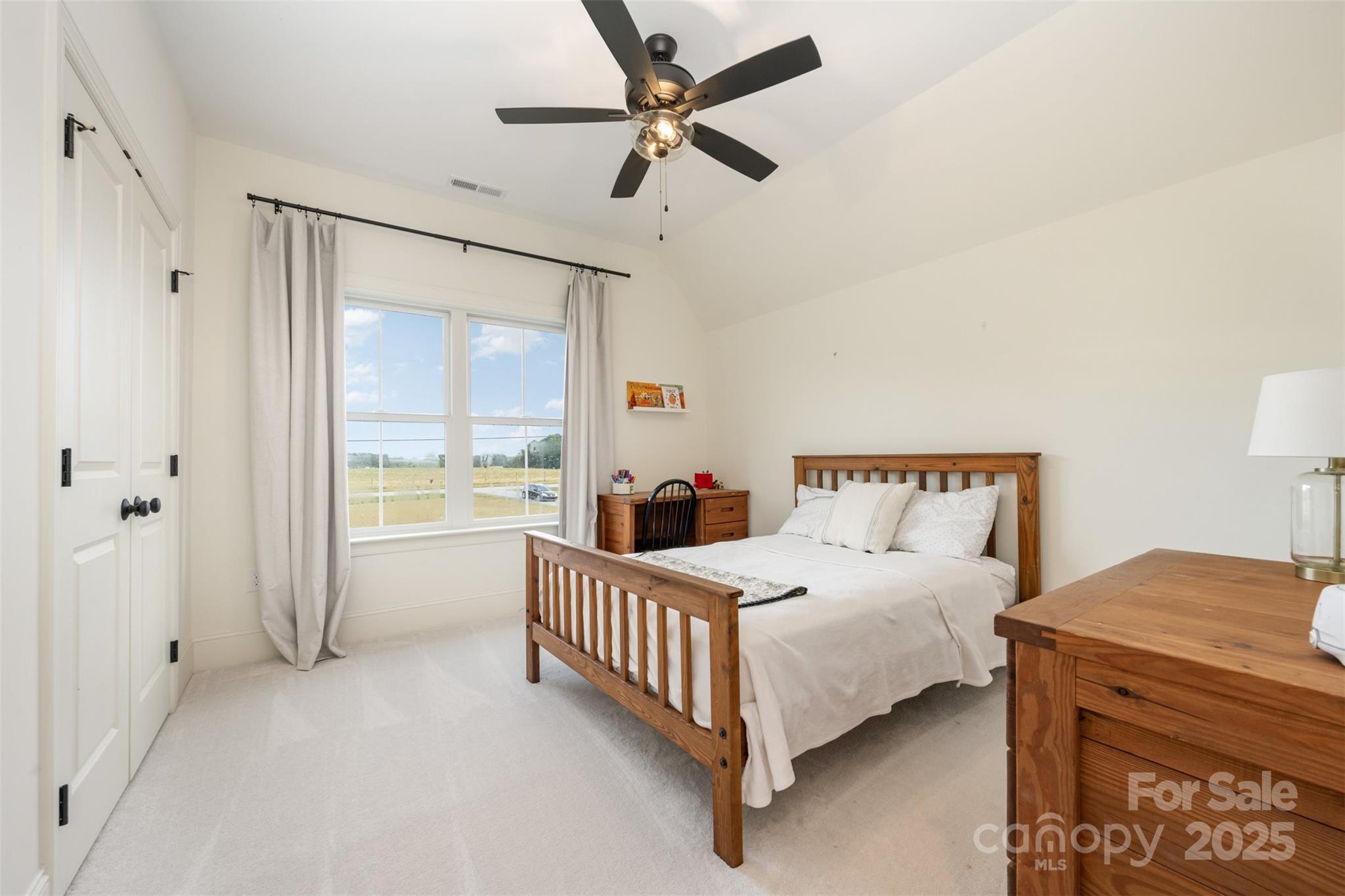 6322 Olive Branch Road Marshville, NC 28103 - Photo 15 of 28 a bedroom with a bed and a large window