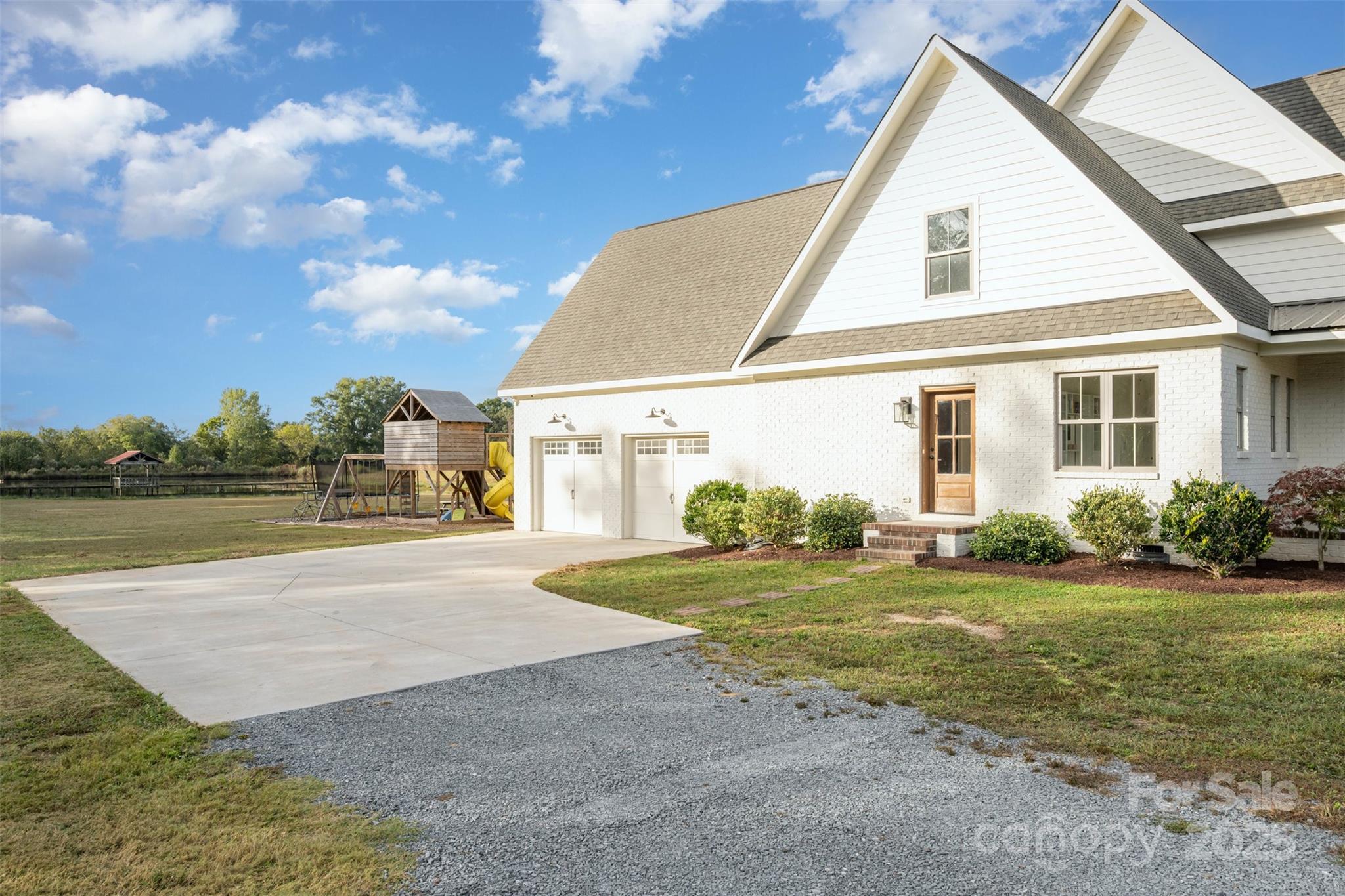 6322 Olive Branch Road Marshville, NC 28103 - Photo 2 of 28 a view of a house with a yard and garage