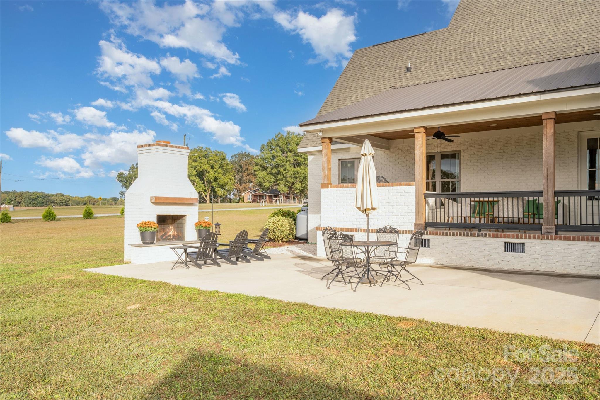 6322 Olive Branch Road Marshville, NC 28103 - Photo 25 of 28 a view of a swimming pool with a table and chairs
