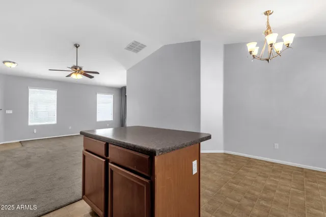 a kitchen that has a lot of cabinets in it