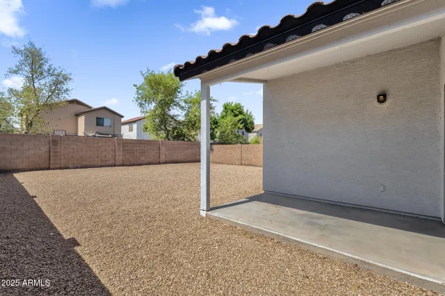 a view of outdoor space with wooden fence